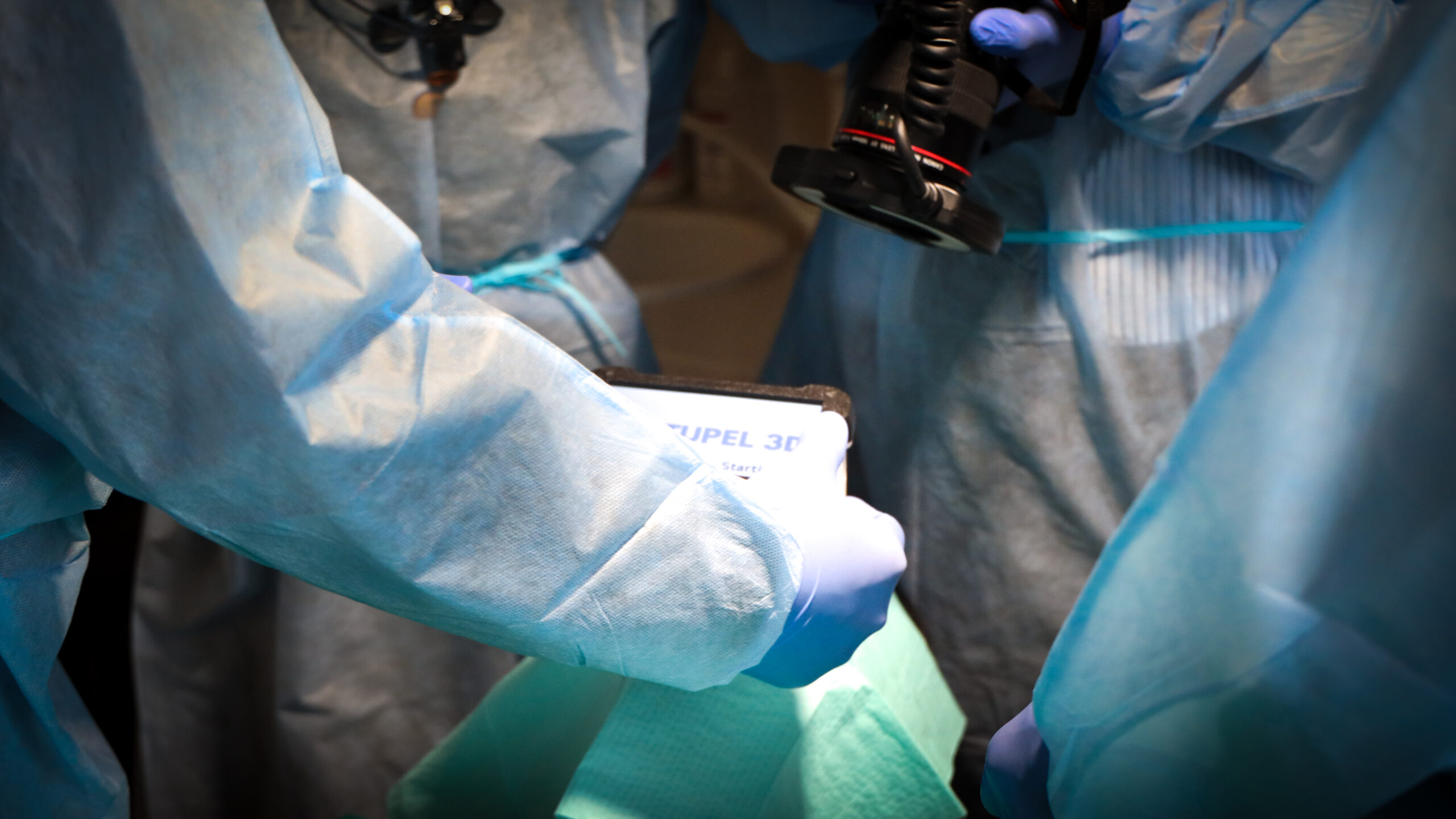 Think Dental Institute faculty and a participant placing a dental implant in a working clinic
