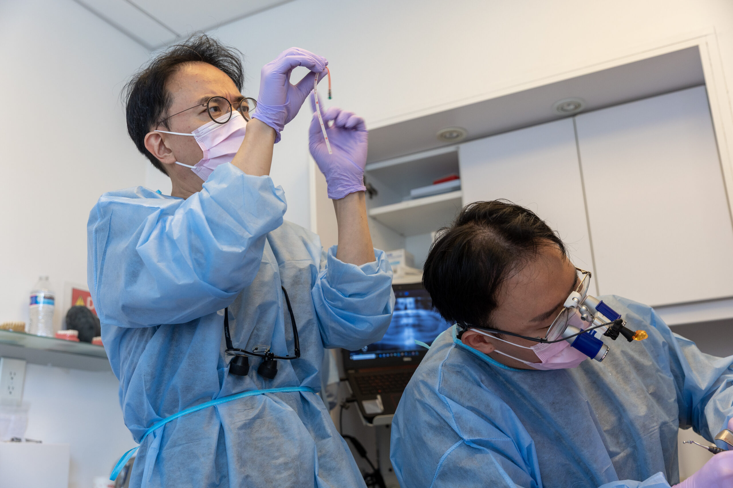 Participants practicing sinus grafting technique during a hands-on workshop